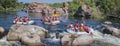 Group of adventurer enjoying rafting river