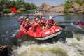 Group of adventurer enjoying rafting river