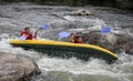 Kayakers fights the white water in a Pivdenny Bug river. They and their kayak are flipping over