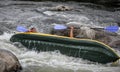 Myhiya / Ukraine - August 24 2018: Kayakers fights the white water in a Pivdenny Bug river. They and their kayak are flipping over