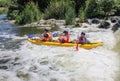 Three man white water kayaking on the river, extreme and fun sport at tourist attraction. Royalty Free Stock Photo