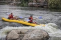 Myhiya / Ukraine - August 24 2018: Two man white water kayaking on the river, extreme and fun sport at tourist attraction.