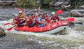 Myhiya / Ukraine - June 24 2018: Group of happy people with guide whitewater rafting and rowing on river, extreme and fun sport