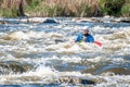 Rafting, kayaking. An unidentified man are sailing on his short Dagger whitewater kayak. Ecological water tourism.