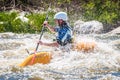 Rafting, kayaking. An unidentified man are sailing on his short Dagger whitewater kayak. Ecological water tourism.