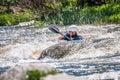 Rafting, kayaking. An unidentified man are sailing on his short Dagger whitewater kayak. Ecological water tourism.