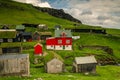 Mykines, Faroe Islands - 07/05/2019Beautiful village of Mykines with colorful houses with grass on the roofs, Mykines island,