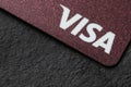 MYKOLAIV, UKRAINE - FEBRUARY 22, 2022: Visa credit card on black background, closeup. Space for text