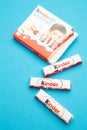 Mykolaiv, Ukraine - July 28, 2023: Bars Of Kinder Chocolate on blue background. Vertical photo