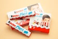 Mykolaiv, Ukraine - July 28, 2023: Kinder chocolate bars on beige background.Kinder bars are produced by Ferrero founded in 1946