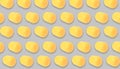 Mykolaiv, Ukraine - June 26, 2023: Yellow plastic capsule from Kinder Surprise Egg on grey background, seamless pattern design