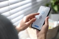 MYKOLAIV, UKRAINE - MARCH 16, 2020: Woman holding iPhone 11 with Telegram app on screen indoors