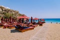 Mykonos Greece April 2018, Super paradise beach during summer with umbrella and luxury beach chairs beds