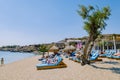 Mykonos Greece April 2018, Super paradise beach during summer with umbrella and luxury beach chairs beds Royalty Free Stock Photo