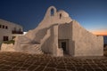 Mykonos, Greece, features an ancient church illuminated by the golden hues of a gorgeous sunset Royalty Free Stock Photo