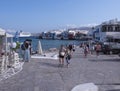 Panoramic view of the sights of the island of Little Venice with walking tourists in Mykonos, Greece. Royalty Free Stock Photo