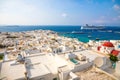 Mykonos, Greece - 17.10.2018: Panoramic view over Mykonos town with white architecture and cruise liner in port, Greece Royalty Free Stock Photo