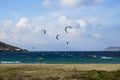 Mykonos, Greece - September 28, 2017: Kitesurfing, kind of extreme water sports in strong wind for windsurfer activity at Korfos Royalty Free Stock Photo