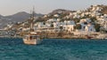 MYKONOS, GREECE- SEPTEMBER, 13, 2016: sailing boat and view towards the new old port of chora, mykonos
