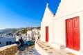 Typical Greek white church with red doors in Mykonos town, Mykonos island, Greece Royalty Free Stock Photo