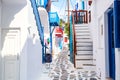 Mykonos old town cozy narrow street with white houses. Mykonos island, Greece