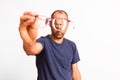 Myopia in mature men is corrected with glasses, a young man holds glasses in his hand Royalty Free Stock Photo