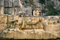 Myra Ancient City. Preserved bas-reliefs with floral ornaments and faces. Demre, Antalya, Turkey Royalty Free Stock Photo