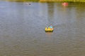 People riding pedalo boat on Khorol river in Myrhorod, Ukraine