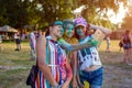 Myrhorod, Ukraine - June 16, 2019: Family taking selfie after throwing paints on indian Holi festival of colors