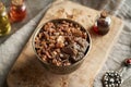 Myrrh resin in a bowl, with myrrh essential oil in the background