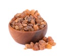 Myrrh resin in wooden bowl, isolated on white background. Pile of natural Commiphora myrrha. Sweet Myrrh Opoponax