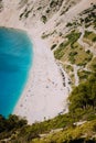 Myrtos beach, Kefalonia island, Greece. Beautiful top view of bay and beach with tourists from above Royalty Free Stock Photo