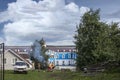 Children are making a fire in front of the central hotel. Volga view