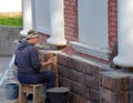 Myshkin, Yaroslavl region, Russia, 03 September, 2020: Restorer repairs old St. Nicholas Chapel St. Nicholas Wonderworker