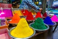 Mysore, India - 12.01.2023: Multicolor bright holi colorful powder in the market for hindus holi festival celebration.