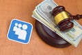 Myspace paper logo lies with judge gavel and hundred dollar bills. Entertainment lawsuit concept