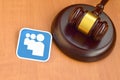 Myspace paper logo lies with wooden judge gavel. Entertainment lawsuit concept