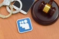 Myspace paper logo lies with wooden judge gavel, smartphone and handcuffs. Entertainment lawsuit concept