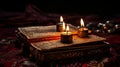 Mysterious ancient ritual book surrounded by burning candles on a table in a dimly lit dark room