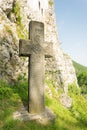 Mysterious ancient stone cross with runic symbols. Landmarks of Bran Castle, Romania Royalty Free Stock Photo