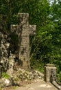 Mysterious ancient stone cross with runic symbols. Landmarks of Bran Castle, Romania Royalty Free Stock Photo