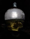 Mysterious backlit greenish liquid in a big glass vessel
