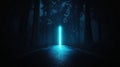 A mysterious blue light pierces the darkness of a forest, casting an ethereal glow on the path below. Royalty Free Stock Photo