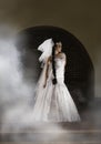 Mysterious bride surrounded by mist