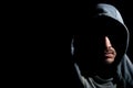 Horizontal portrait shot of mysterious young bearded hooded man Royalty Free Stock Photo