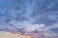 Mysterious clouds at twilight with a glimpse of the setting sun Royalty Free Stock Photo