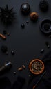 Mysterious dark flat lay arrangement of spices herbs and natural elements on black background Royalty Free Stock Photo