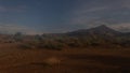 Mysterious desert landscape under a moonlit night sky