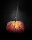 Mysterious, eerie plume of smoke rises from a diminutive apple