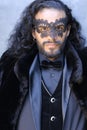 Mysterious elegant long haired man in masquerade